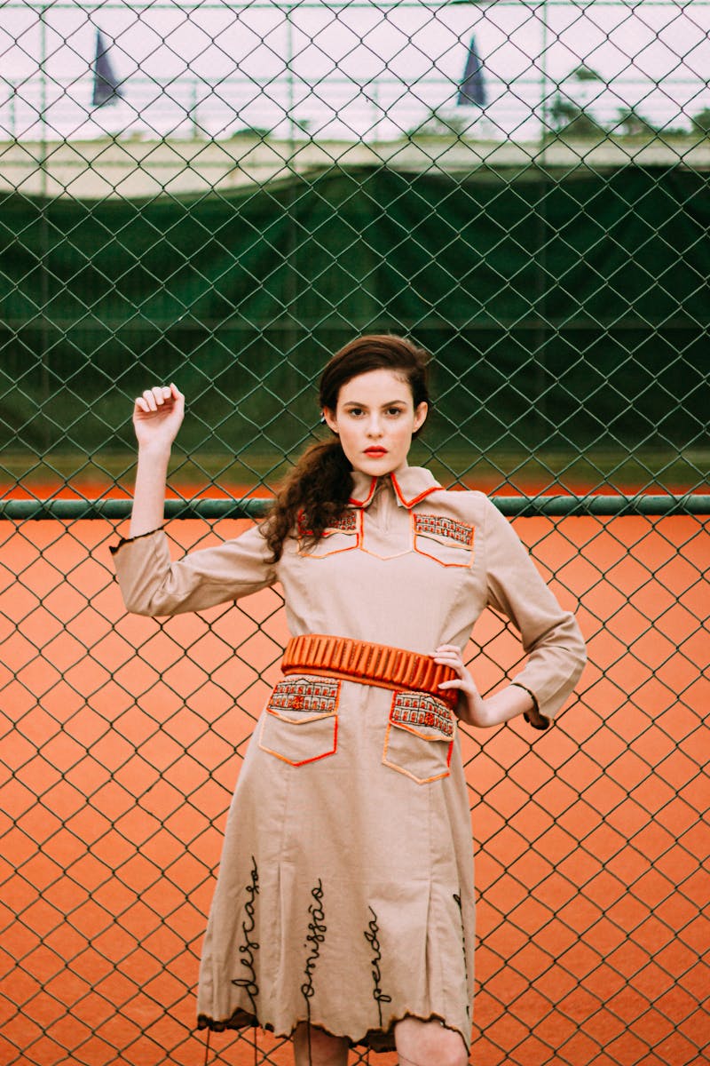 Fashionable Woman Posing on Tennis Court